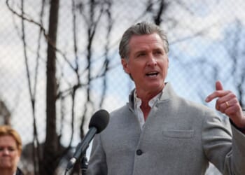 Gov. Gavin Newsom speaks at a press conference at Odyssey Charter School as work begins to remove debris from the Eaton Fire in Altadena, California.
