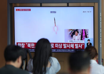 A TV screen shows a reporting of North Korea's unidentified projectile with file footage during a news program at the Seoul Railway Station in Seoul, South Korea, on May 26, 2026.