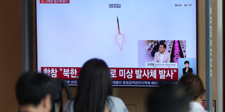 A TV screen shows a reporting of North Korea's unidentified projectile with file footage during a news program at the Seoul Railway Station in Seoul, South Korea, on May 26, 2026.