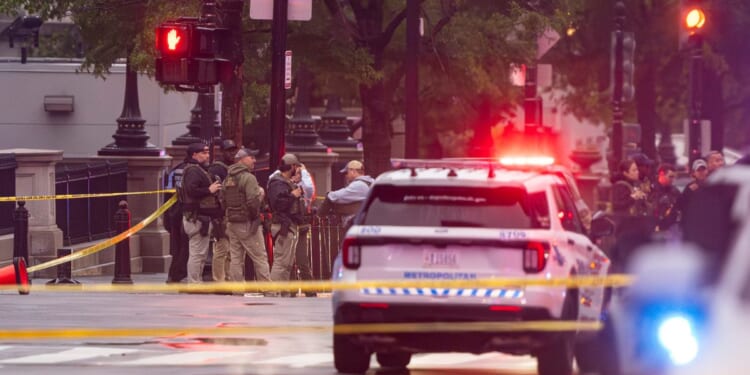 Emergency teams work the scene after multiple gunshots ring out outside the White House on May 23, 2026, in Washington, D.C.