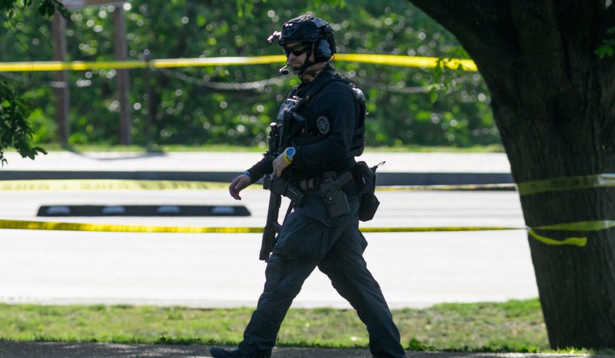 Police respond after a person was shot by law enforcement near the Washington Monument in Washington, Monday, May 4,, 2026. (AP Photo/Rod Lamkey Jr.)
