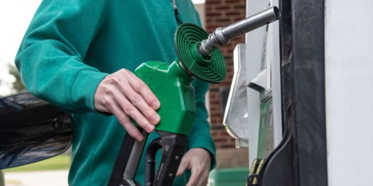 A person pumps gas at a gas station on April 30, 2026.