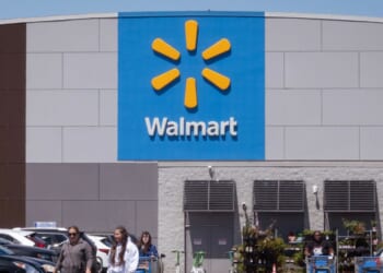 Customers shop at a Walmart store on May 13, 2026, in Chicago, Illinois.