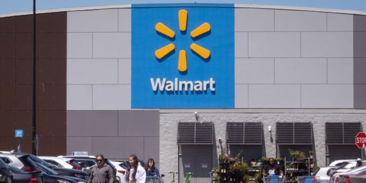 Customers shop at a Walmart store on May 13, 2026, in Chicago, Illinois.