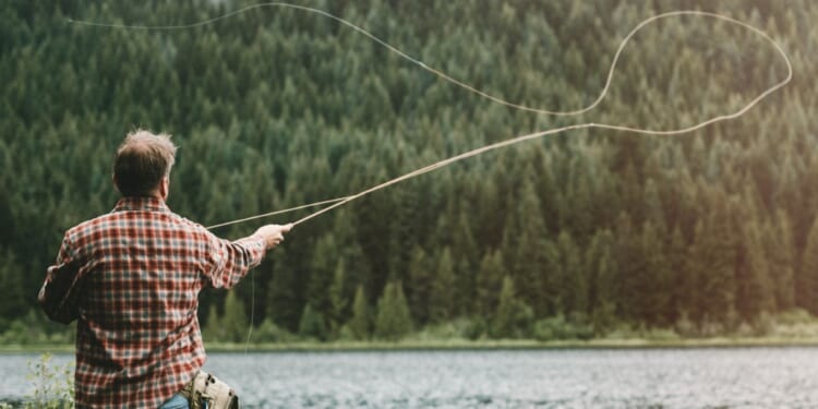 Scenes like this one of a man fly fishing in an Oregon lake may soon be a thing of the past, as animal rights actviists have gathered enough signatures to get a measure on November's ballot that would ban hunting and fishing.