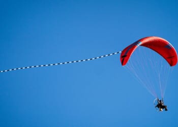 A paraglider flies through the sky on March 21, 2026, in Torrington, Wyoming.