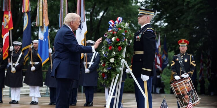 President Donald Trump participates in a Memorial Day wreath-laying ceremony at the Tomb of the Unknown Soldier at Arlington National Cemetery on May 25, 2026, in Arlington, Virginia.