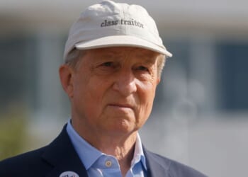 California gubernatorial candidate Tom Steyer, a Democrat, sports a hat that reads "class traitor" during a May 18 rally in Los Angeles