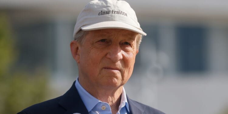 California gubernatorial candidate Tom Steyer, a Democrat, sports a hat that reads "class traitor" during a May 18 rally in Los Angeles