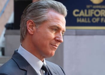 California Gov. Gavin Newsom, seen in a March photo, has raised some eyebrows with his behavior in videos circulating online.