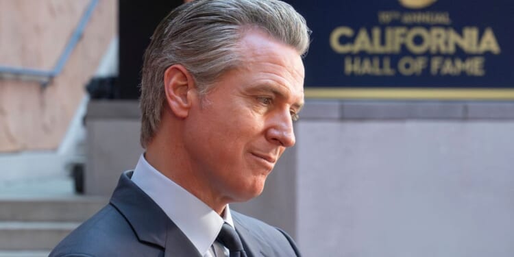 California Gov. Gavin Newsom, seen in a March photo, has raised some eyebrows with his behavior in videos circulating online.