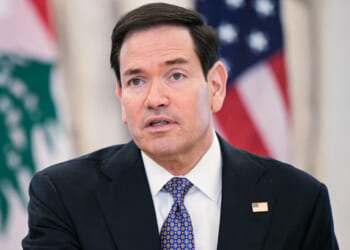 Marco Rubio speaks to reporters at a summit.