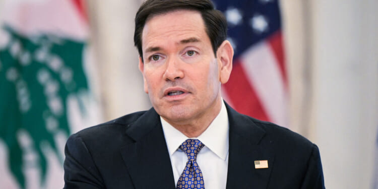 Marco Rubio speaks to reporters at a summit.
