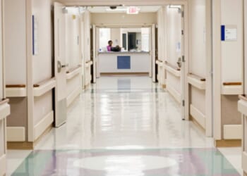 A hospital hallway stands empty.