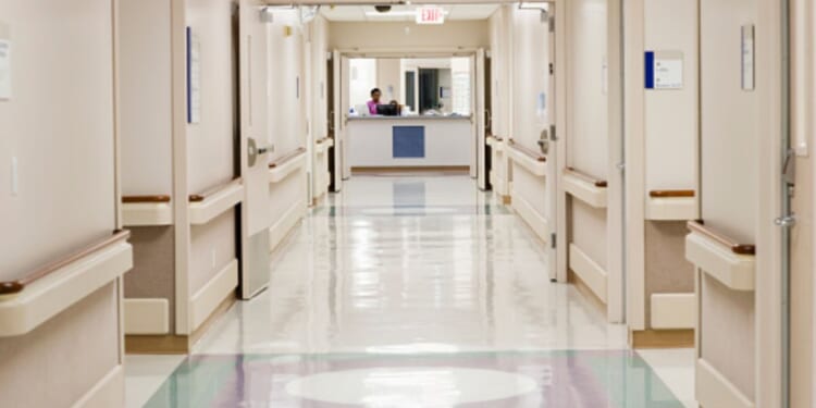 A hospital hallway stands empty.