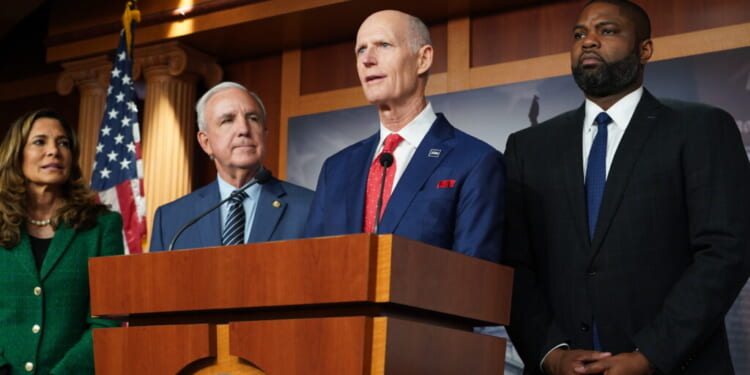 Sen. Rick Scott (c), Rep. Carlos Gimenez, Rep. Maria Elvira Salazar, and Rep. Byron Donalds.