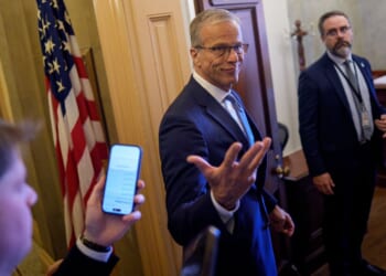 Senate Majority Leader John Thune, a South Dakota Republican, gestures pauses to speak to reporters Thursday as he walks into his office at the U.S. Capitol Building in Washington, D.C.