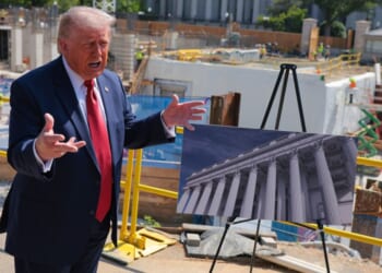 President Donald Trump speaks to the media Tuesday alongside posters of his proposed White House ballroom amid construction at the White House in Washington, D.C.
