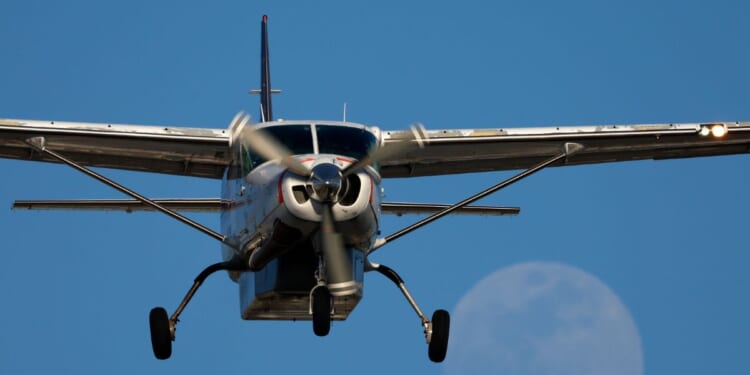A FedEx Cessna Super Cargomaster airplane flies to San Diego International Airport in San Diego on May 9, 2025.