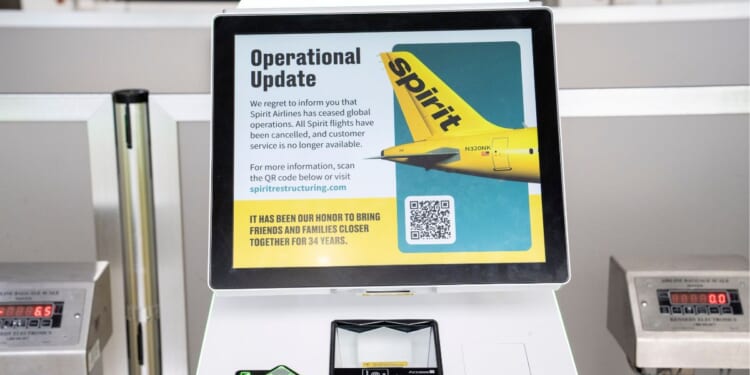 The Spirit Airlines ticket counter at Detroit Metro Airport is closed down after the airline shut down Saturday in Romulus, Michigan.