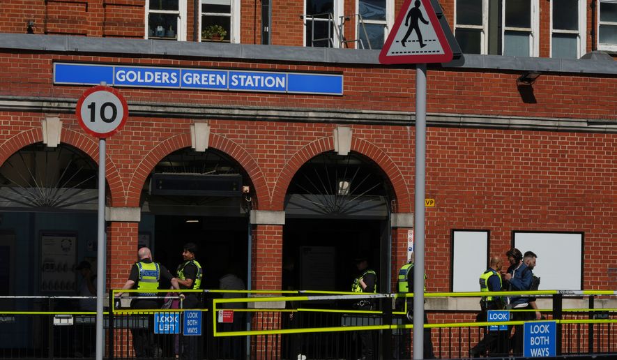 Police on duty outside Golders Green tube station in London, Thursday, April 30, 2026, near the scene where two people were recently stabbed in the Golders Green neighbourhood, that has a large Jewish community. (AP Photo/Alastair Grant)