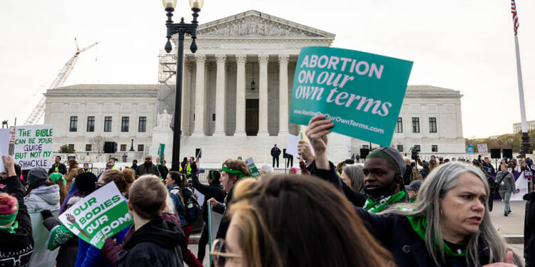 Demonstrators gather in front of the Supreme Court as the court hears oral arguments in the case of the U.S. Food and Drug Administration v. Alliance for Hippocratic Medicine on March 26, 2024 in Washington, DC. (Anna Rose Layden/Getty Images)