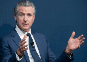 Gov. Gavin Newsom of California waves his hands in the air.