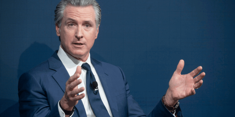 Gov. Gavin Newsom of California waves his hands in the air.