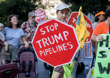 Climate activists march across the Brooklyn Bridge to demand that New York Governor Kathy Hochul stop the construction of the Williams Pipeline. Protests against this pipeline have previously shut down the pipeline that supplies fracked gas. (Photo by Michael Nigro/Pacific Press/LightRocket via Getty Images)