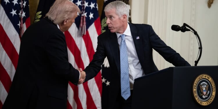 Chris Wright greets President Donald Trump