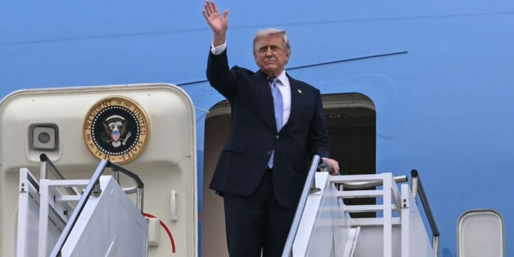 President Donald Trump boards Air Force One before his departure from Beijing Capital Airport in Beijing on May 15, 2026.
