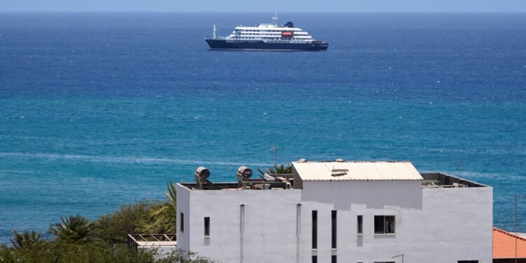 The MV Hondius cruise ship remained anchored Monday at a port in Praia, Cape Verde, off the west coast of Africa.