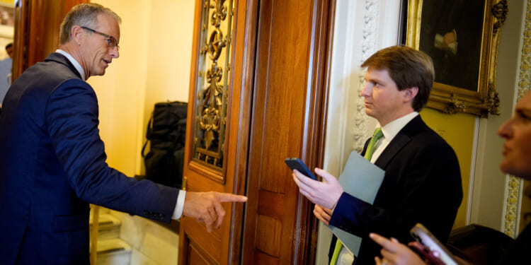 Senate Majority Leader John Thune (R-SD) speaks to reporters as he walks into the Senate Chamber of the U.S.