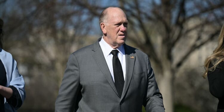White House Border Czar Tom Homan walks on the White House grounds as journalists wait for President Donald Trump to return from Dover Air Force Base in Delaware after attending a dignified transfer solemn event on March 18, 2026.