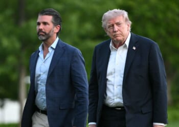 President Donald Trump and Donald Trump Jr. walk on the south lawn toward the White House in Washington, D.C., on May 3, 2026.