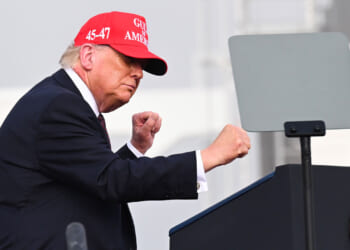 Donald Trump dances as he departs after speaking at the Port of Corpus Christi on February 27, 2026 in Corpus Christi, Texas.