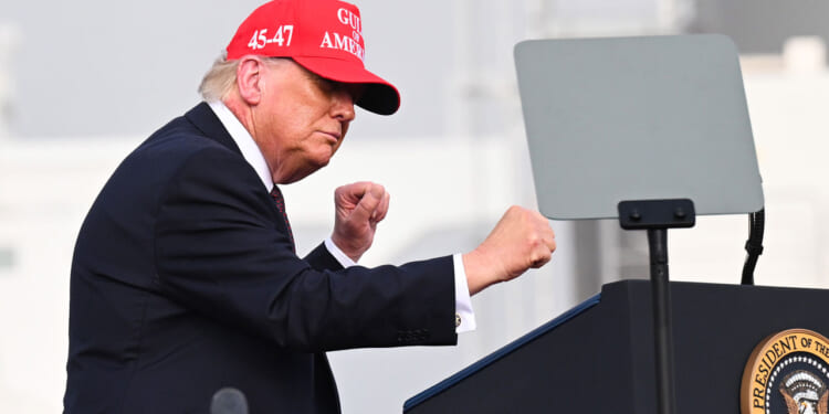 Donald Trump dances as he departs after speaking at the Port of Corpus Christi on February 27, 2026 in Corpus Christi, Texas.