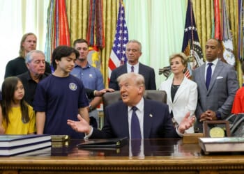 President Donald Trump is joined by, from left, Major League Baseball pitcher Noah Syndergaard, retired professional golfer Gary Player, professional golfer Bryson DeChambeau, Secretary of Health and Human Services Robert F. Kennedy Jr., Education Secretary Linda McMahon, Secretary of Housing and Urban Development Scott Turner, Secretary of War Pete Hegseth and young athletes during a proclamation signing Tuesday in the Oval Office of the White House in Washington, D.C. Trump signed a presidential memorandum restoring the Presidential Fitness Test Award, reintroducing a performance-based benchmark in physical education.