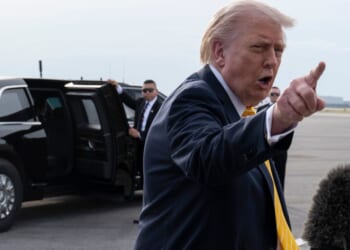President Donald Trump speaks to journalists before boarding Air Force One at Palm Beach International Airport Saturday in Palm Beach, Florida.