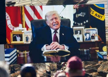 Attendees watch a pre-recorded video of President Donald Trump reading from the Bible during "Rededicate 250: A National Jubilee of Prayer, Praise, and Thanksgiving" on the National Mall in Washington, D.C., on May 17, 2026.