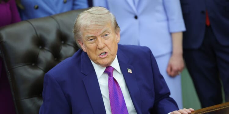 President Donald Trump answers a question from a reporter during an event on maternal healthcare in the Oval Office of the White House on May 11, 2026, in Washington, D.C.