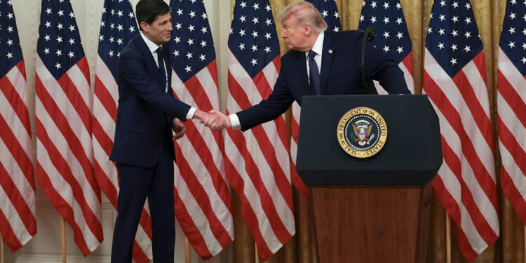 Kevin Warsh and Donald Trump shake hands