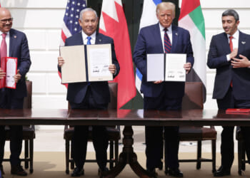 President Trump, Israeli Prime Minister Benjamin Netanyahu and the foreign ministers of Bahrain and the UEA hold up signed copies of the Abraham Accords during White House Ceremony.