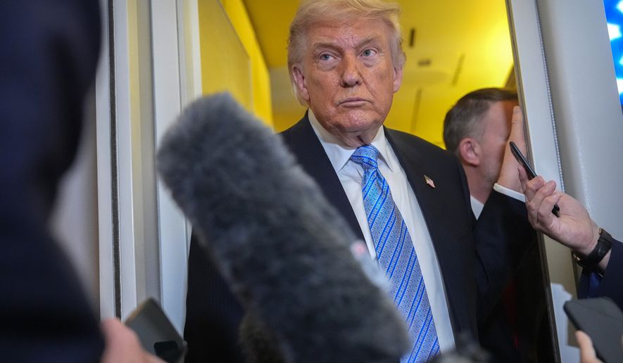 President Donald Trump speaks to reporters aboard Air Force One, Friday, May 15, 2026, as he returns from a trip to Beijing, China. (AP Photo/Mark Schiefelbein)