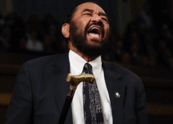 Al Green waves cain in House of representatives.