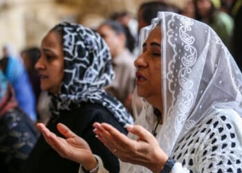 Coptic Christians attend a Palm Sunday Mass at the Monastery of Simon the Tanner in Cairo, Egypt, on April 5, 2026.