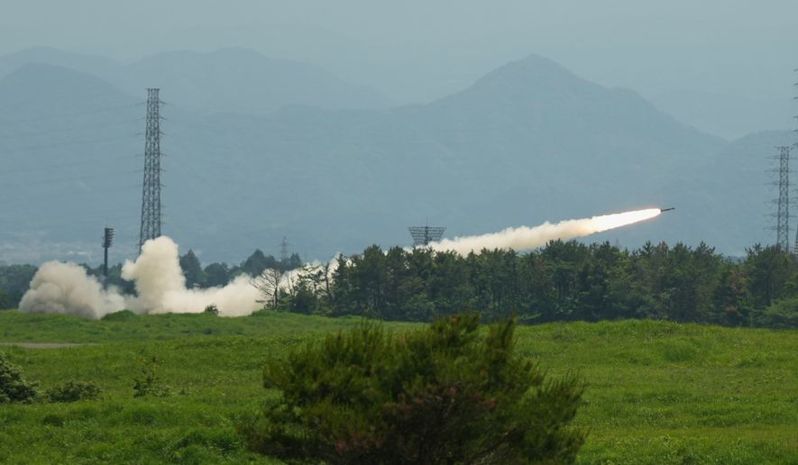 U.S. Marines conduct a live-fire training of the High Mobility Artillery Rocket System, short for HIMARS, at Camp Fuji, in Gotemba, southwest of Tokyo, Wednesday, May 20, 2026. (AP Photo/Hiro Komae)