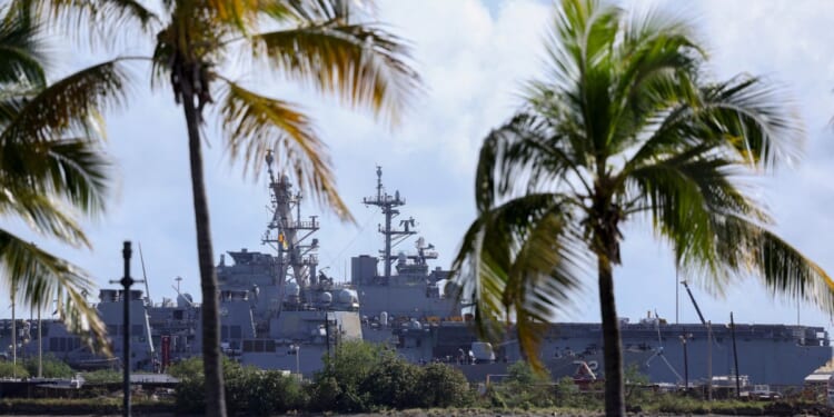 The USS Mahan, an Arleigh Burke-class guided-missile destroyer, is docked at the port of Ponce, Puerto Rico, with the USS Iwo Jima, a US Navy Wasp-class amphibious assault ship, in the background on Jan. 15, 2026.