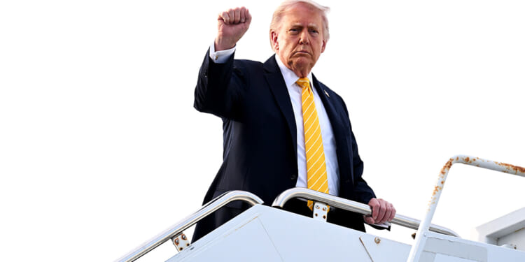 President Donald Trump raises a fist as he departs Doral, Florida en route to his Palm Beach mansion on May 02, 2026 in Palm Beach, Florida. (Roberto Schmidt/Getty Images)
