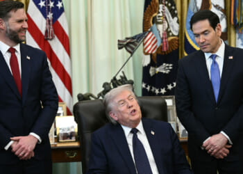 JD Vance and Marco Rubio flank President Trump as he sits at his desk in Oval Office,
